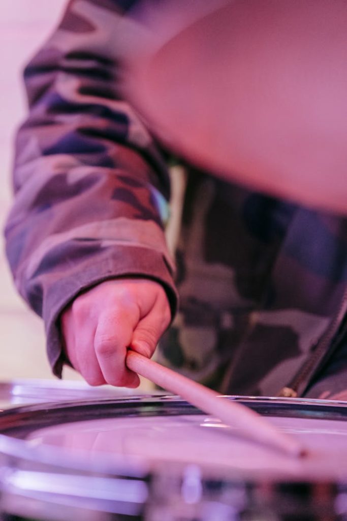 A Person Holding Brown Drumstick